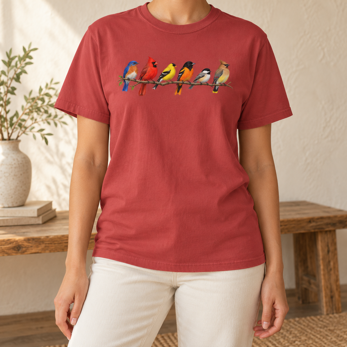Colorful Birds on Branches t-shirt in Crimson — six painted songbirds on one branch: chickadee, goldfinch, cedar waxwing, northern cardinal, Baltimore oriole and eastern bluebird, on a garment-dyed Comfort Colors tee