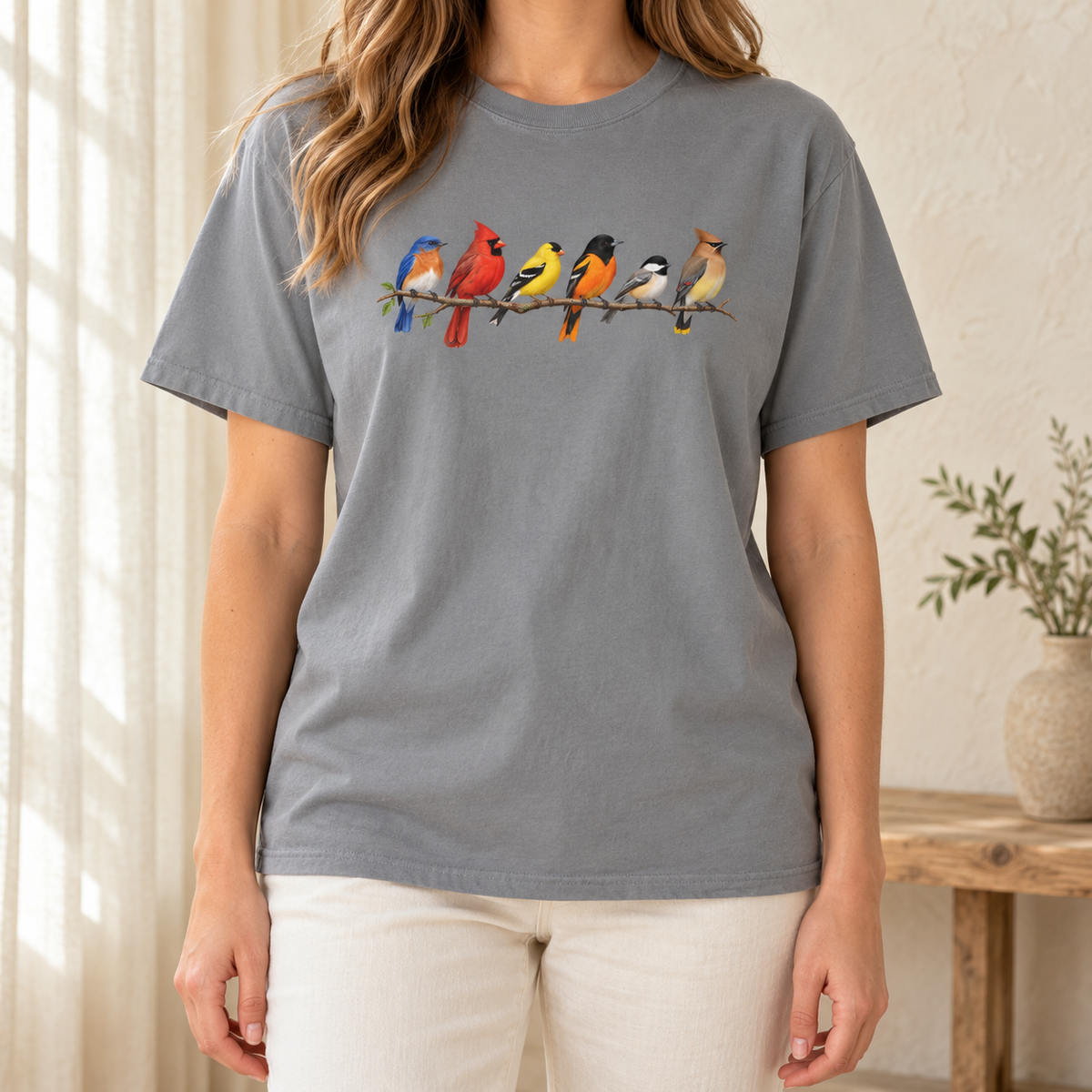 Colorful Birds on Branches t-shirt in Grey — six painted songbirds on one branch: chickadee, goldfinch, cedar waxwing, northern cardinal, Baltimore oriole and eastern bluebird, on a garment-dyed Comfort Colors tee