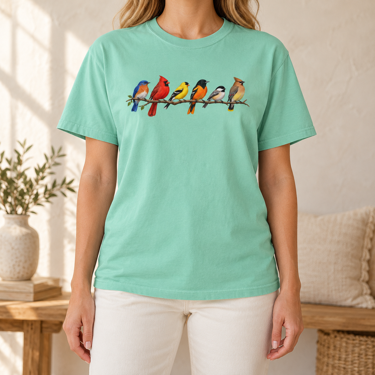 Colorful Birds on Branches t-shirt in Island Reef — six painted songbirds on one branch: chickadee, goldfinch, cedar waxwing, northern cardinal, Baltimore oriole and eastern bluebird, on a garment-dyed Comfort Colors tee