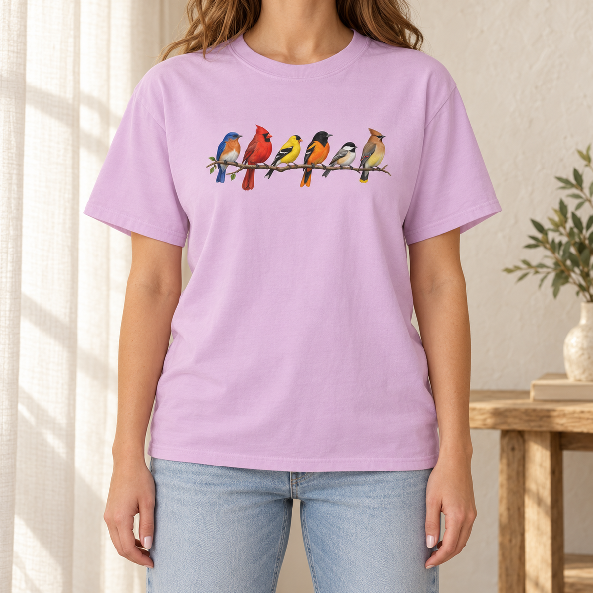 Colorful Birds on Branches t-shirt in Orchid — six painted songbirds on one branch: chickadee, goldfinch, cedar waxwing, northern cardinal, Baltimore oriole and eastern bluebird, on a garment-dyed Comfort Colors tee