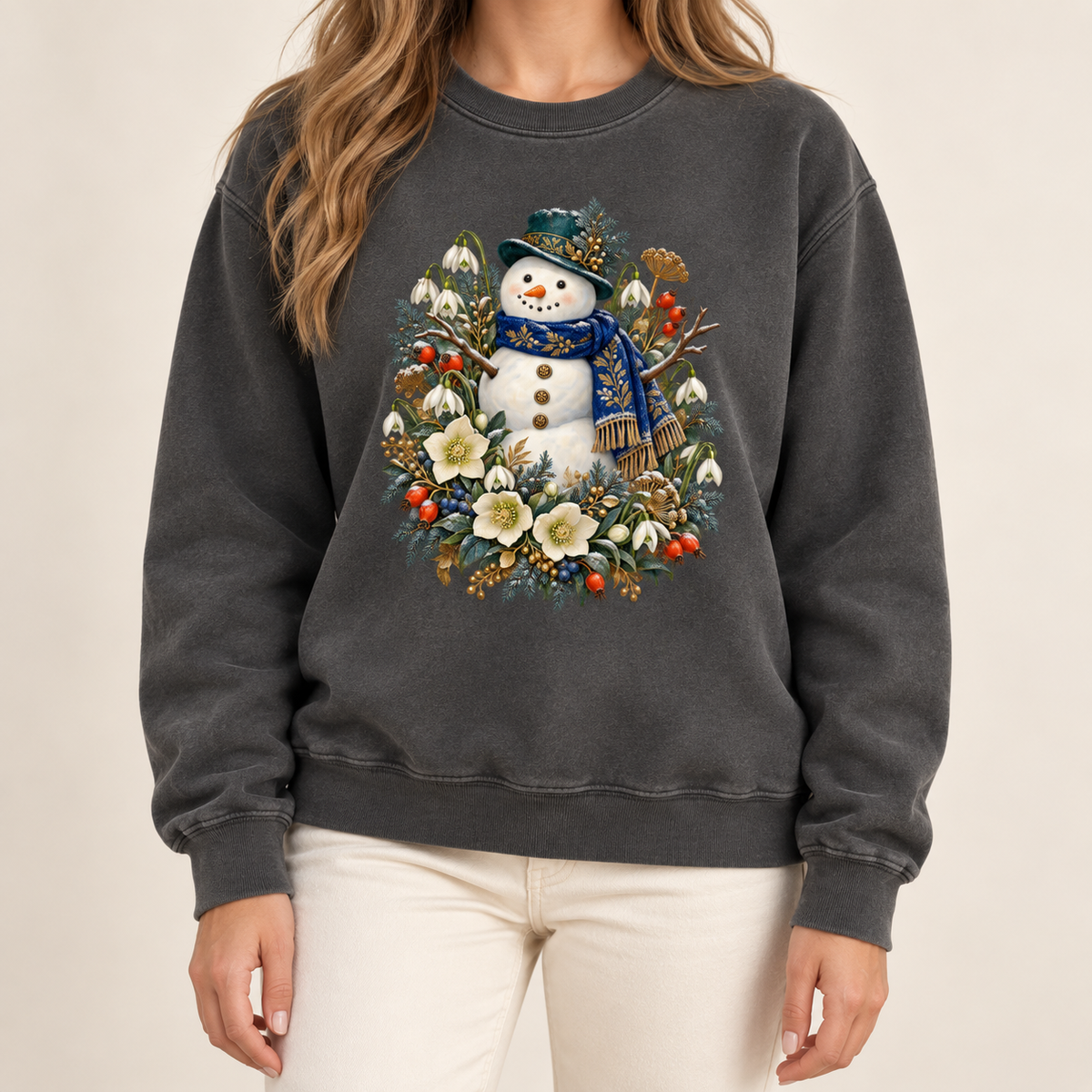 Snowman and winter botanicals design on a heavyweight garment-dyed Comfort Colors 1566 crewneck — a smiling snowman in a dark hat and blue scarf among evergreen, red berries and cream flowers