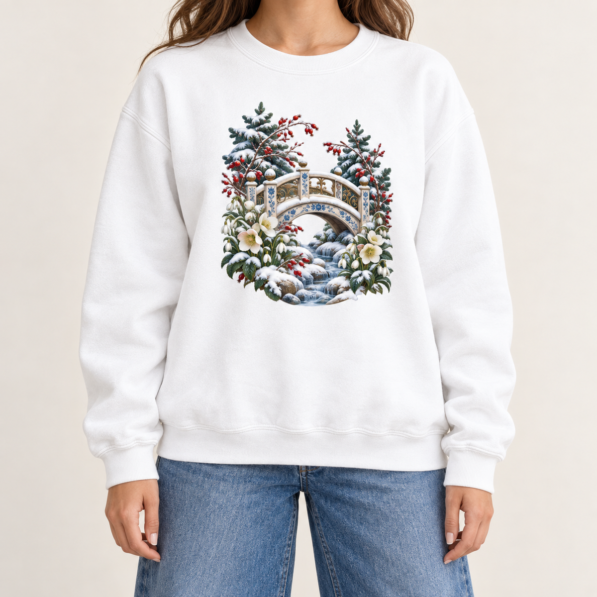Vintage winter landscape design on a side-seamed Comfort Colors 1566 crewneck — an ornate ivory footbridge arching over a snowy rocky stream, framed by evergreen, red berries and cream flowers