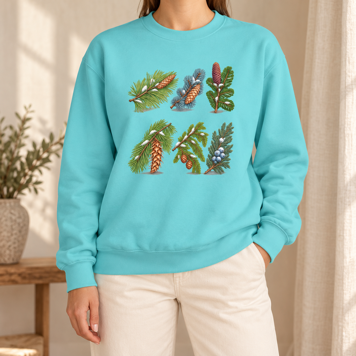 Evergreen Study Sweatshirt in Chalky Mint - six watercolor conifer sprigs with cones and snow laid out like a botanical plate, printed on a garment-dyed Comfort Colors 1566 crewneck