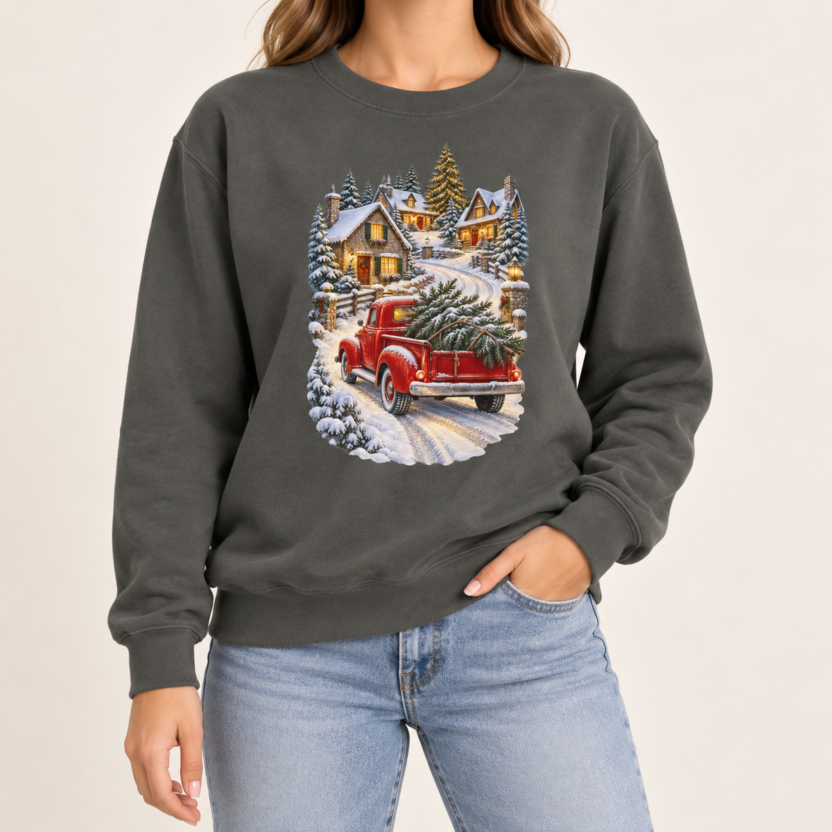 Red truck Christmas sweatshirt in Pepper: a vintage red pickup bringing a Christmas tree home through a snowy village, on a deep charcoal garment-dyed Comfort Colors crewneck