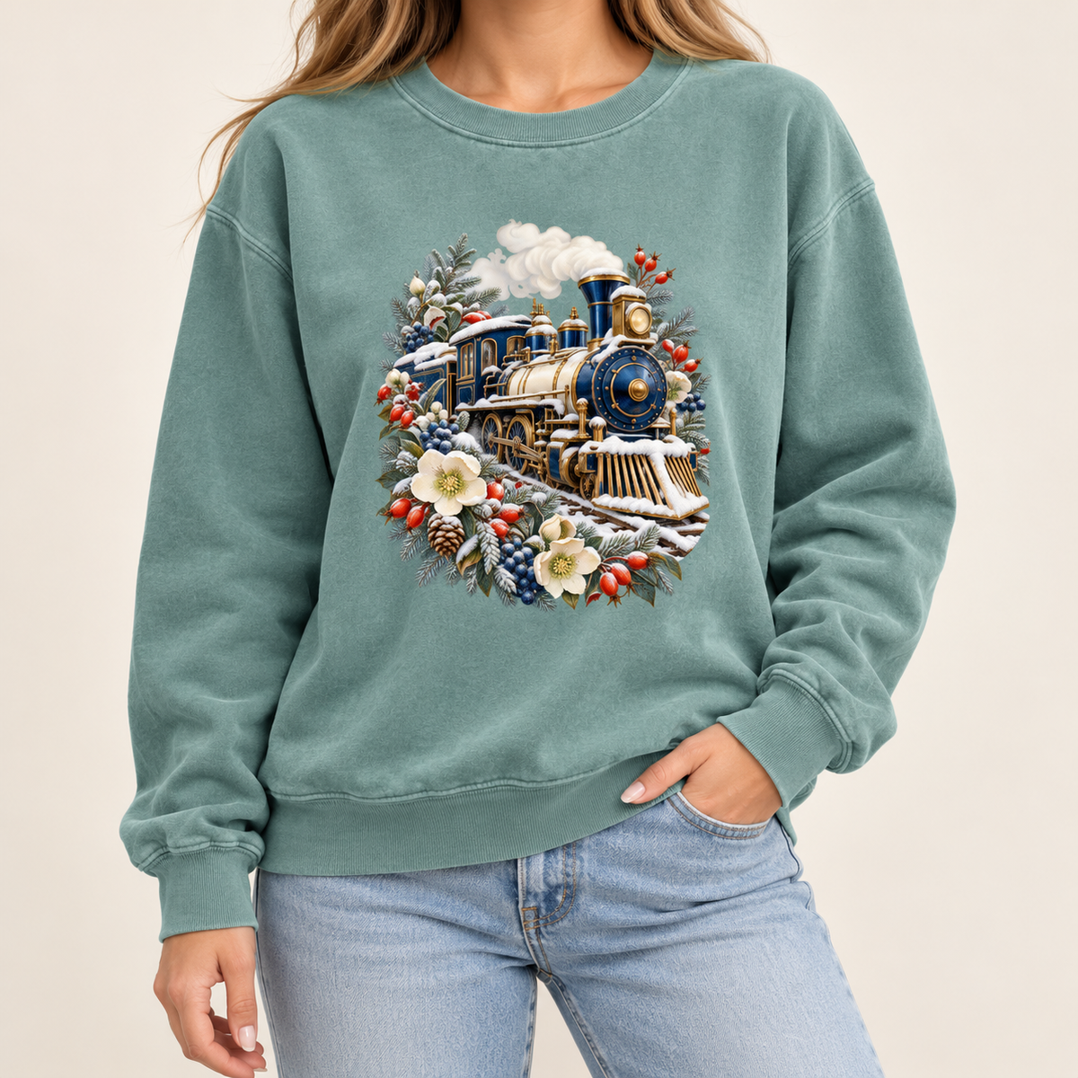 Steam train winter crewneck with 1x1 ribbed collar, cuffs and waistband — a deep blue and gold steam locomotive ringed by snow-dusted evergreen, red berries, pinecones and cream flowers