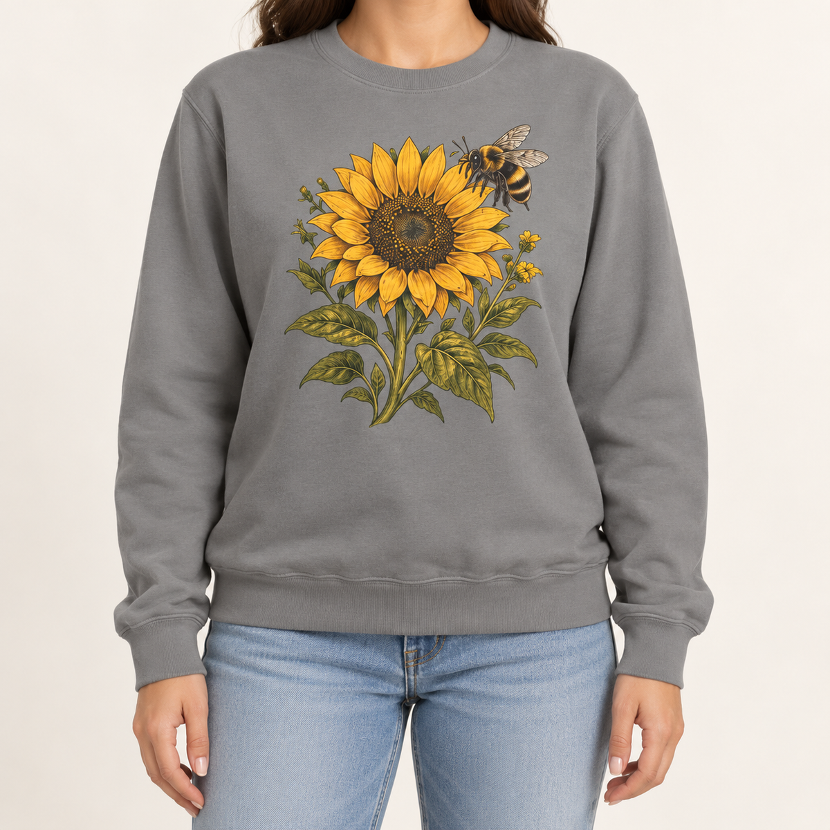 Sunflower and bumblebee sweatshirt, a golden sunflower with a hovering bumblebee and olive leaves printed large on a garment-dyed Comfort Colors crewneck
