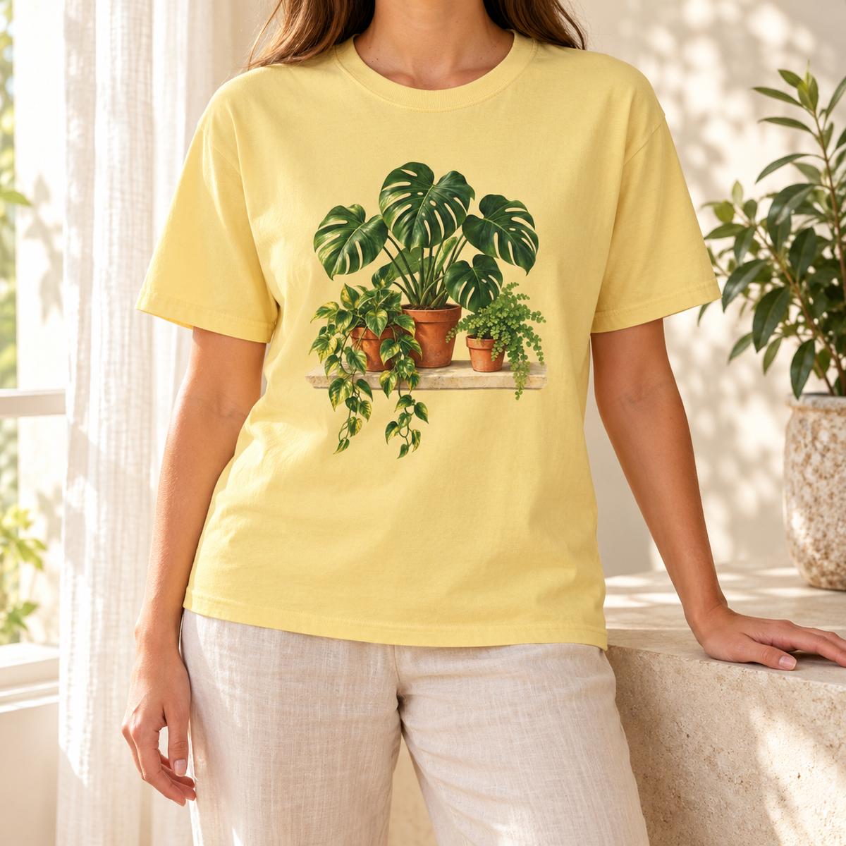Houseplant t-shirt in Butter – pale sun-washed yellow Comfort Colors tee with the monstera, pothos and fern in terracotta pots