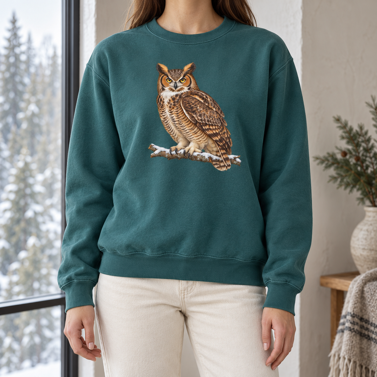 Great horned owl sweatshirt in Blue Spruce in winter light – the buff-breasted owl on a snowy branch on a deep evergreen Comfort Colors 1566 crewneck