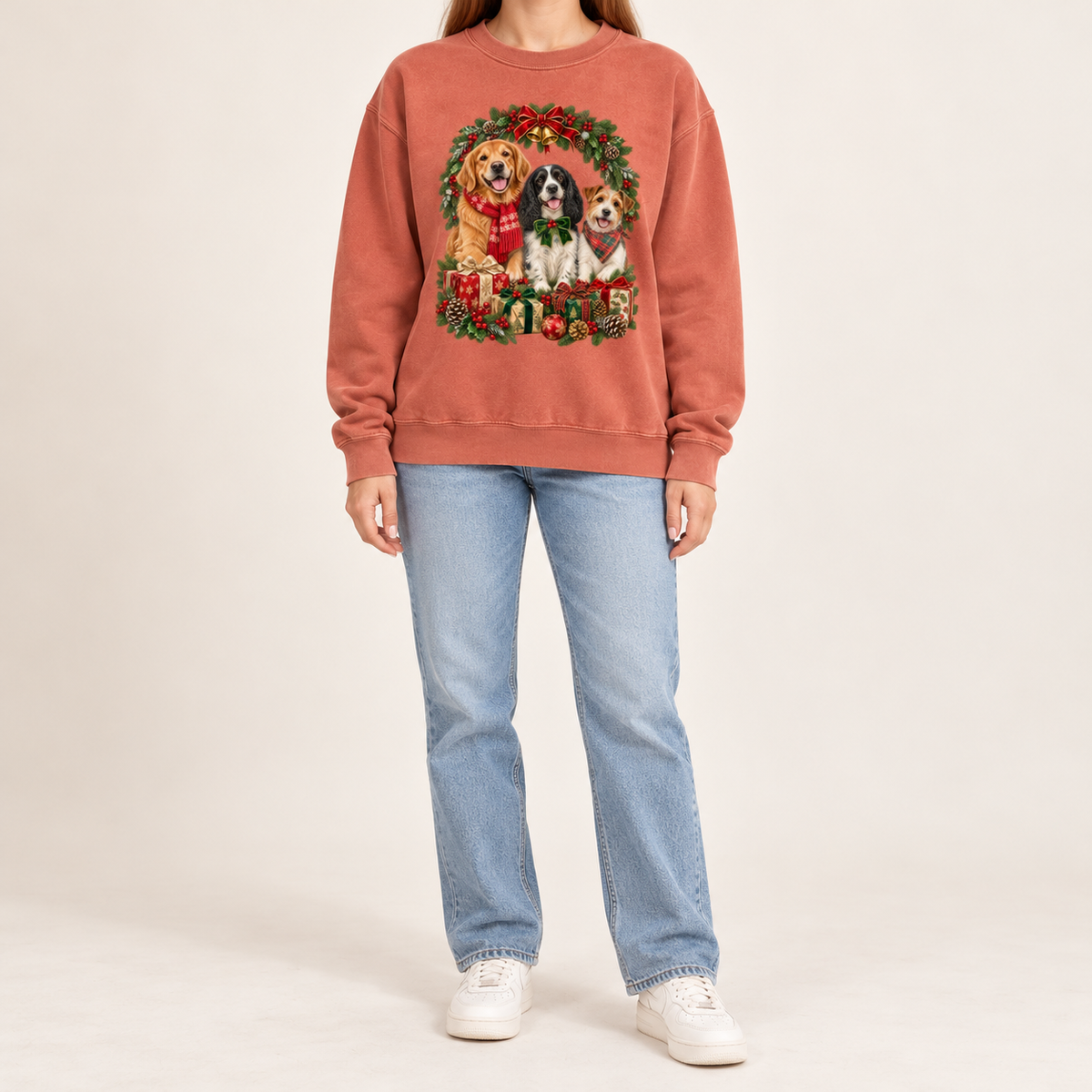 The three-dog Christmas wreath print shown on the Terracotta garment-dyed Comfort Colors 1566 crewneck sweatshirt