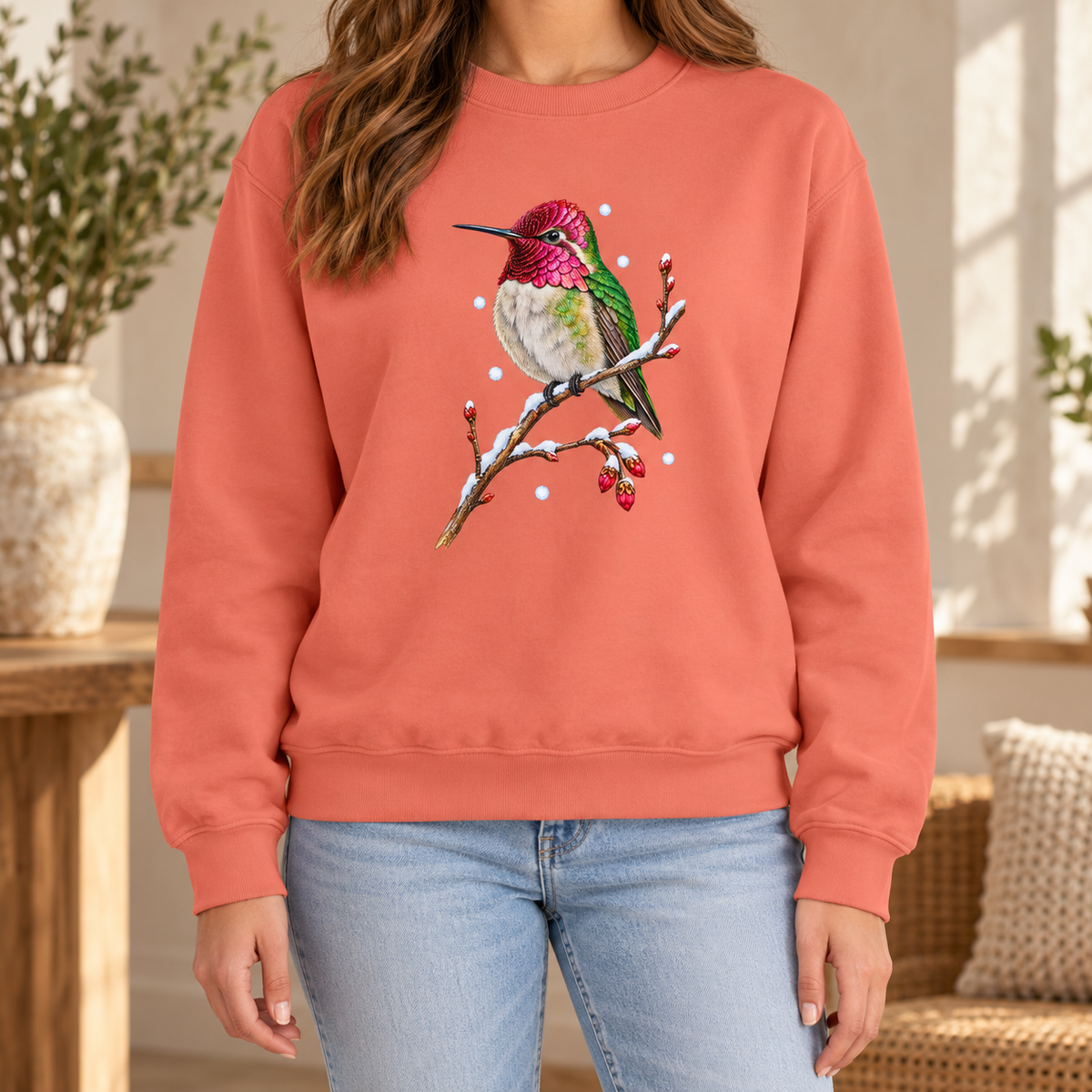 Winter Hummingbird Sweatshirt in Terracotta - a watercolor Anna's hummingbird with a magenta head perched on a snowy twig, printed on a garment-dyed Comfort Colors 1566 crewneck