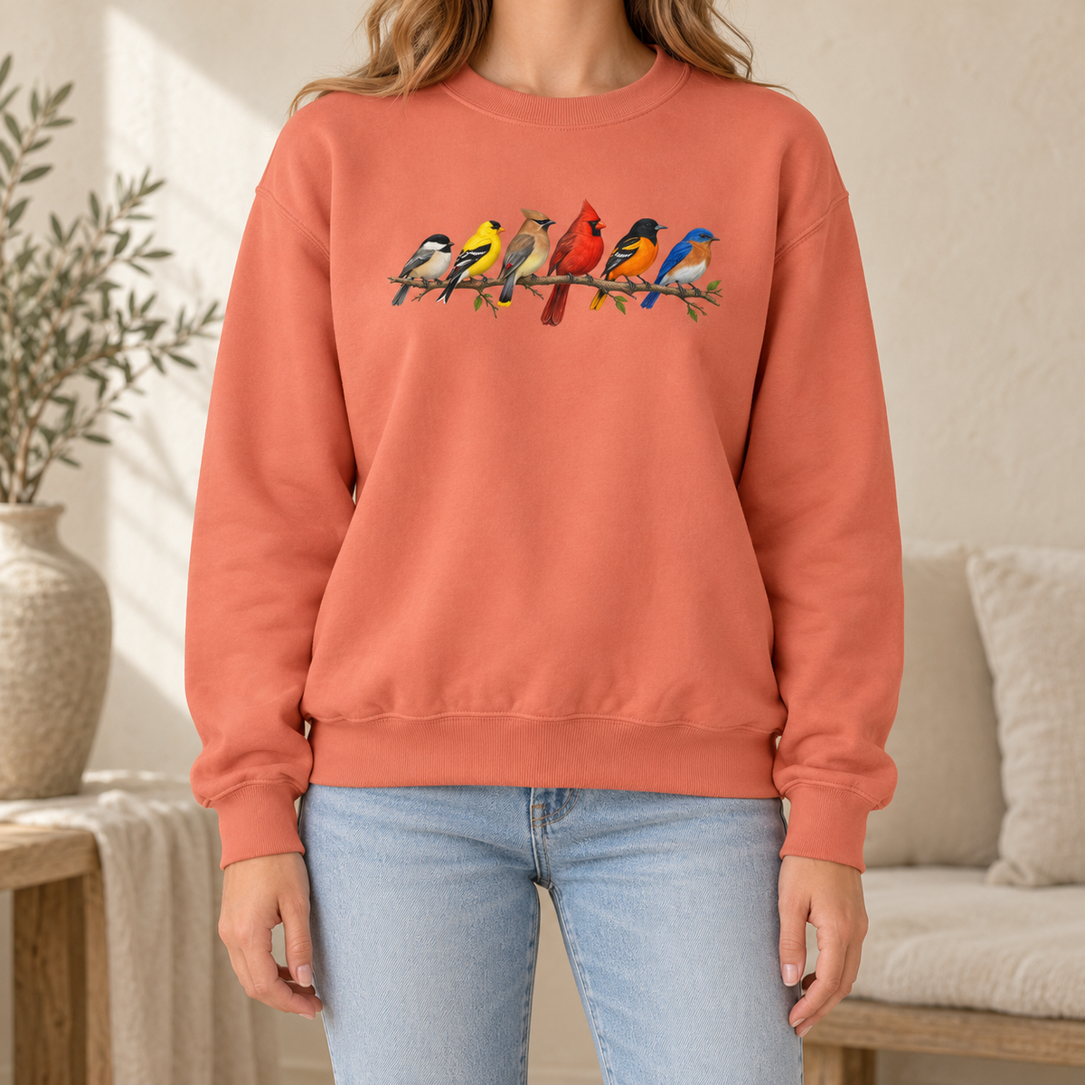 Colorful Birds on Branches sweatshirt in Terracotta — six painted songbirds on one branch: chickadee, goldfinch, cedar waxwing, northern cardinal, Baltimore oriole and eastern bluebird, on a garment-dyed Comfort Colors crewneck