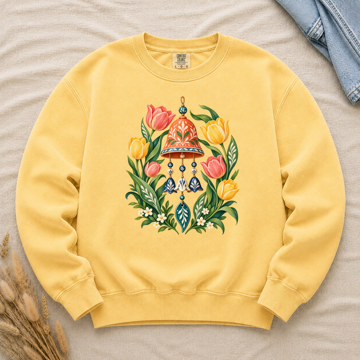 Garden Wind Chime & Tulip Sweatshirt in Butter — a warm sunny pairing that lifts the coral bell and blue pendants