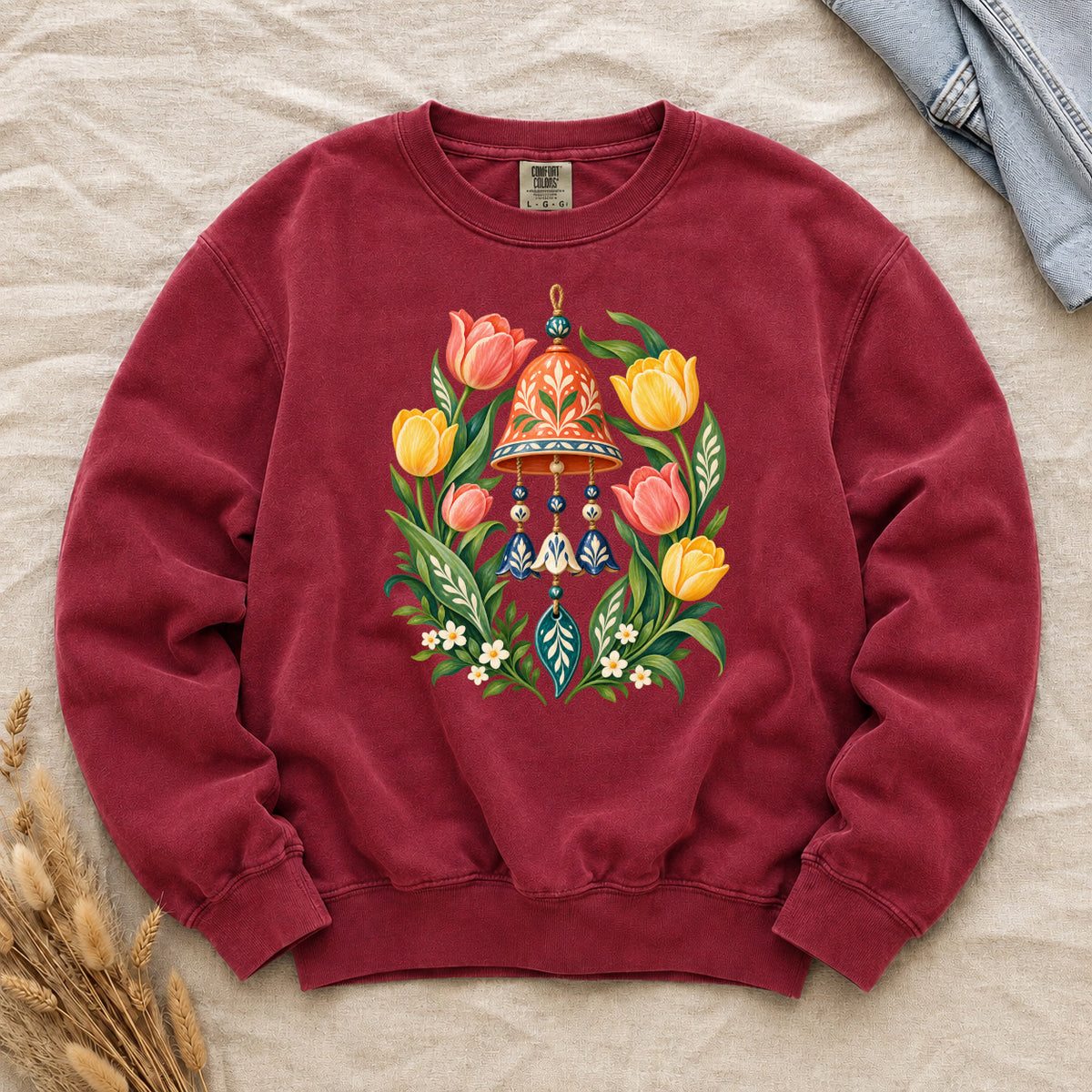 Garden Wind Chime & Tulip Sweatshirt in Crimson — a warm bold option highlighting the yellow flowers and cream details