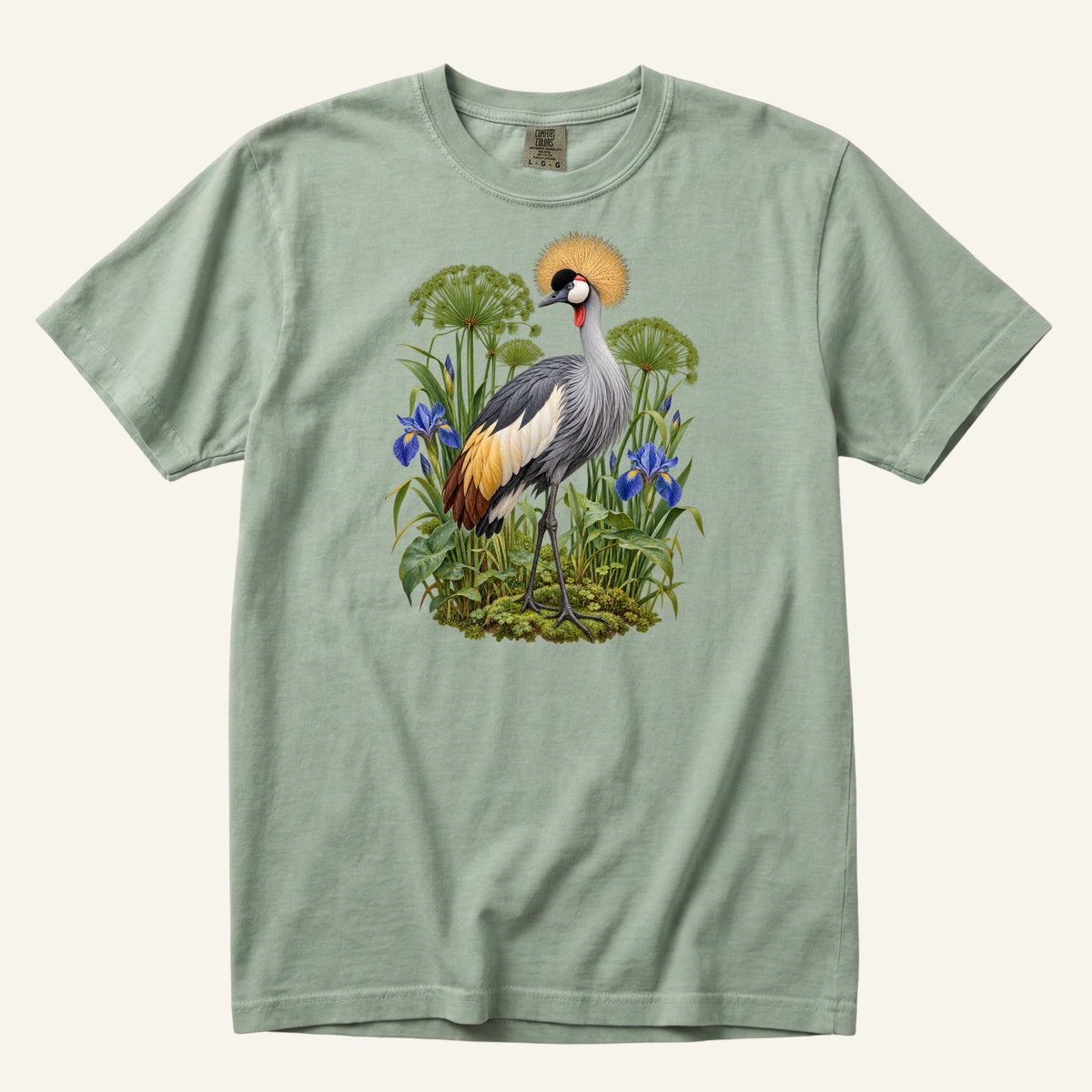 Crowned crane with a golden crest among blue irises and green stems, printed on a Bay sea green Comfort Colors 1717 unisex t-shirt