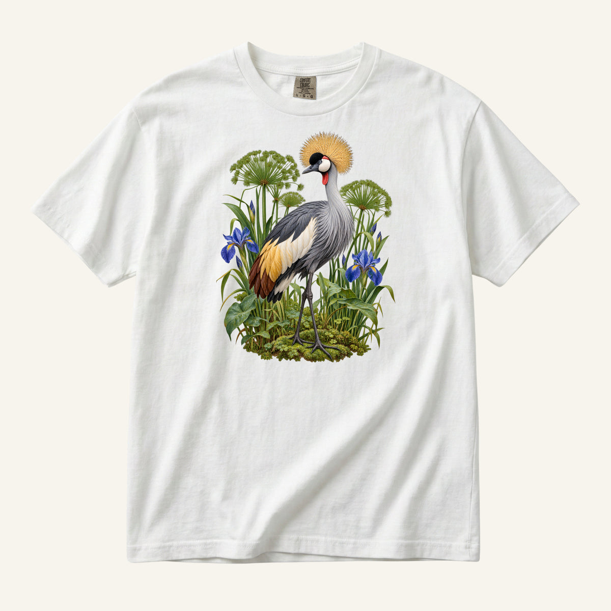 Crowned crane with a golden crest among blue irises and green stems, printed on a white Comfort Colors 1717 unisex t-shirt