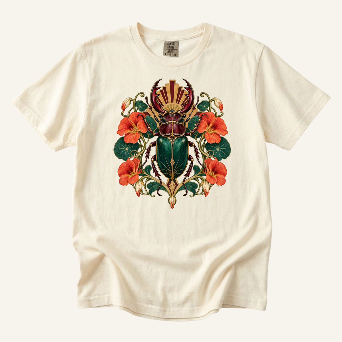 The Emerald Guardian T-Shirt in Ivory — an emerald stag beetle among orange nasturtiums with golden Art Deco detail