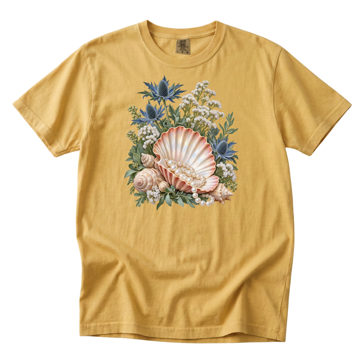 The Sea Came Home premium seashell tee in Mustard, a scallop shell and pearls still life