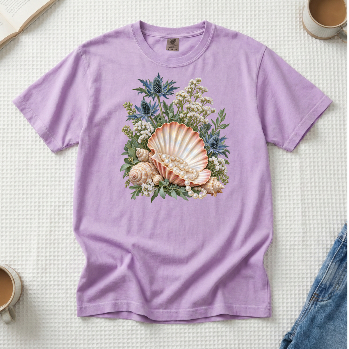The Sea Came Home premium seashell tee in Orchid, shells with blue sea holly