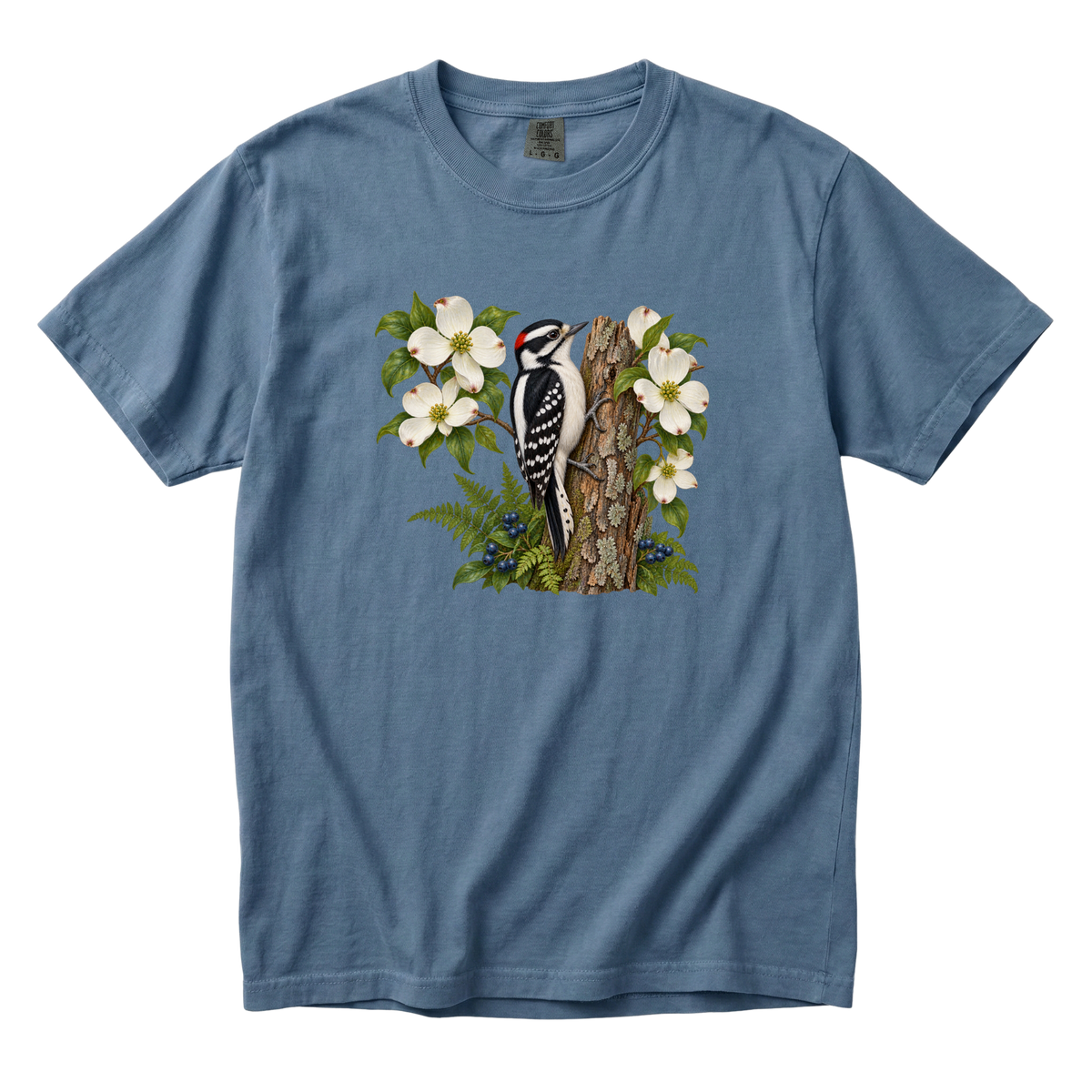 The Woods Have Rhythm woodpecker tee in Blue Jean, a woodpecker on bark with dogwood blossoms