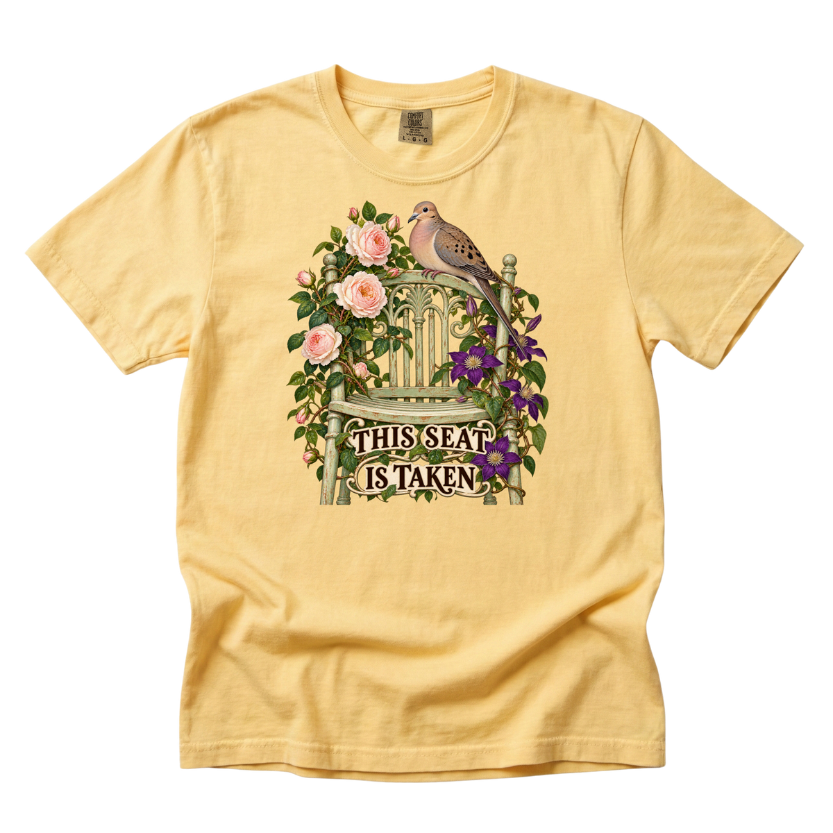 This Seat Is Taken tee in Butter, a funny dove and garden chair botanical print