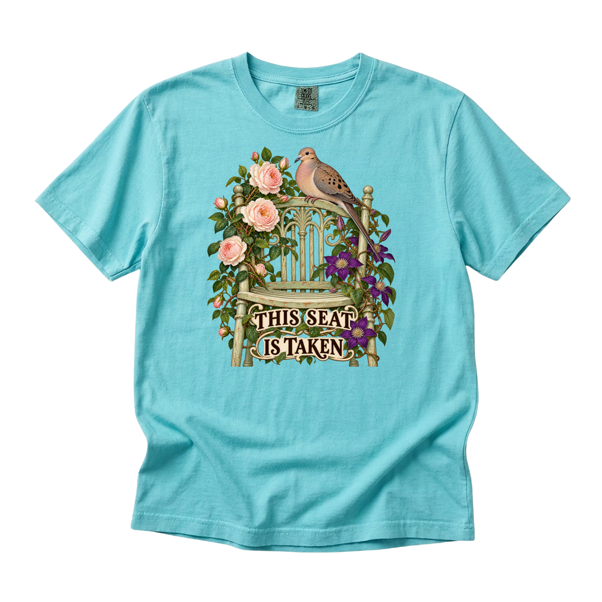 This Seat Is Taken tee in Lagoon Blue, a dove perched above peach roses and purple flowers