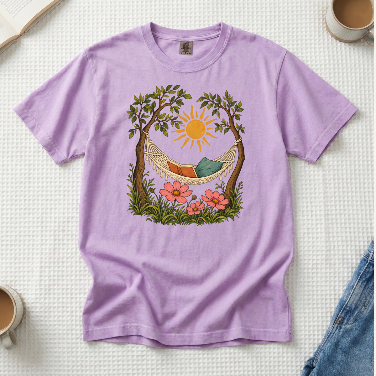 This Counts as Plans T-Shirt in Orchid — a gentle purple against the golden sun and green foliage