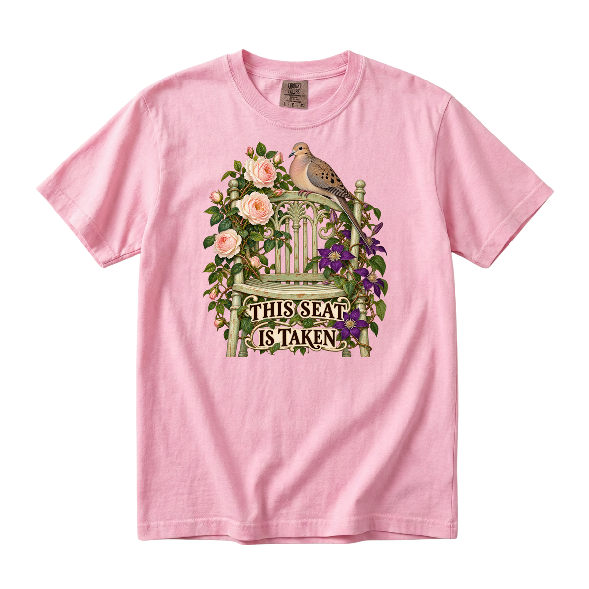 This Seat Is Taken tee in Blossom, a dove on a green garden chair with climbing roses