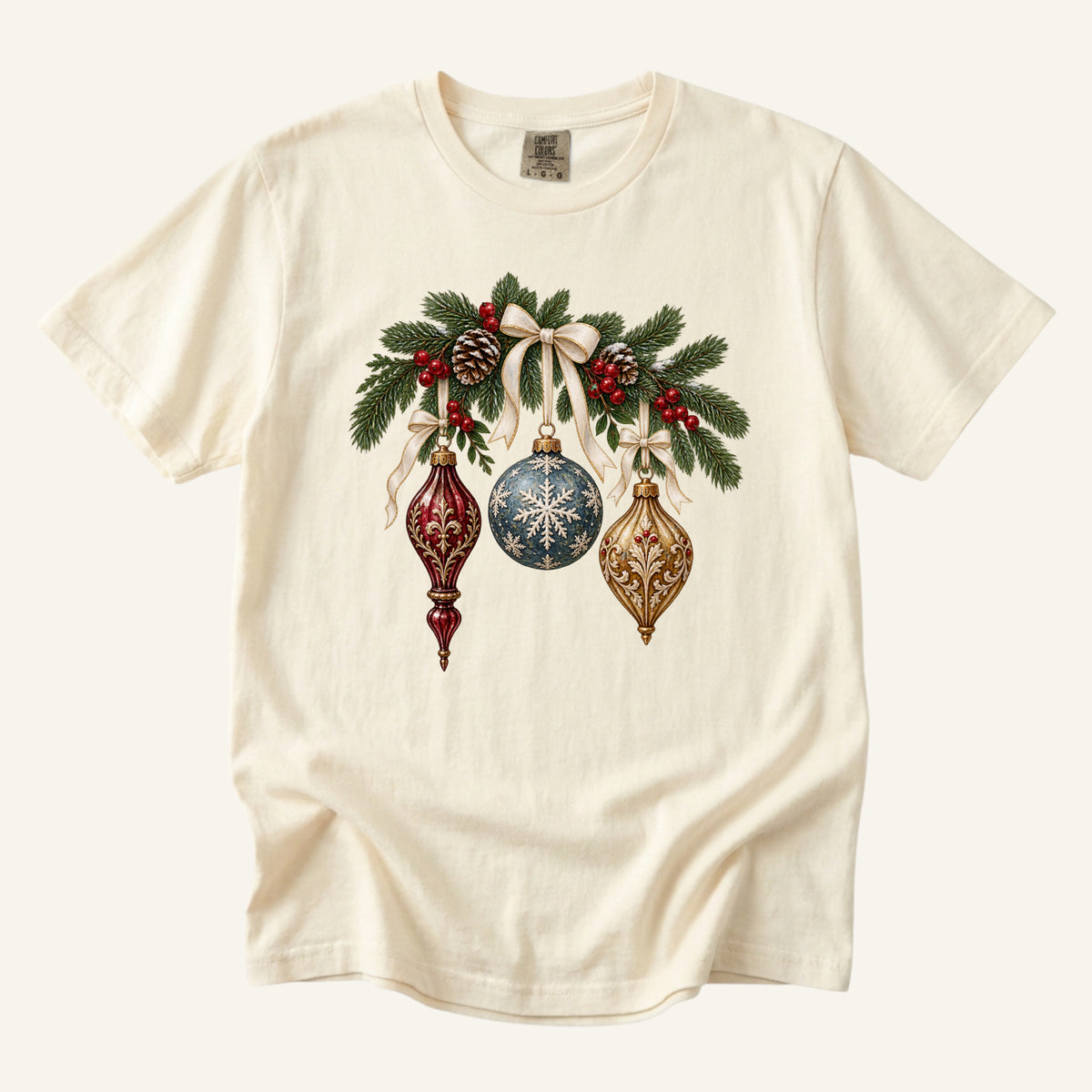 Vintage Christmas Ornaments T-Shirt in Ivory — three ornate baubles in burgundy, blue and antique gold with evergreen and a cream bow