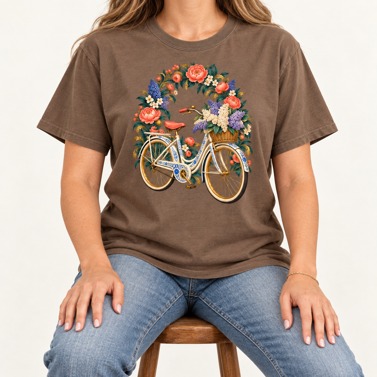 The bicycle's coral saddle, golden wheels and blue ornamental details