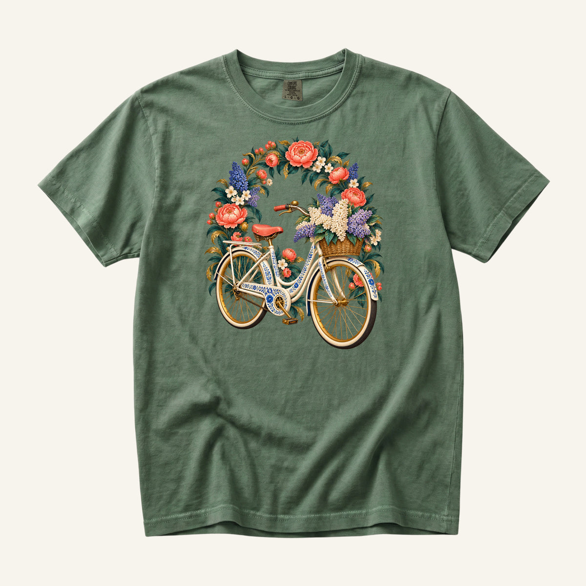 She Took the Flower Route vintage floral bicycle t-shirt in Moss, a cream-and-gold vintage bicycle beneath an arch of coral roses, its woven front basket overflowing with cream and lavender blooms