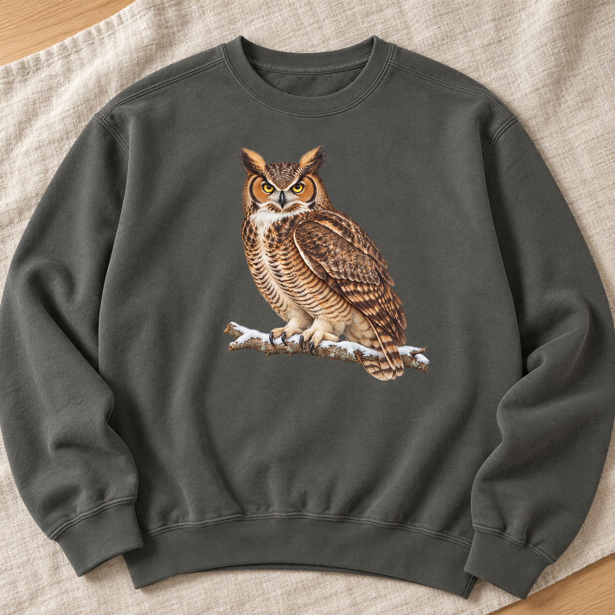 Great horned owl sweatshirt in Pepper, flat lay – the watercolor owl on a snowy branch printed large and centered on a washed charcoal Comfort Colors 1566 crewneck