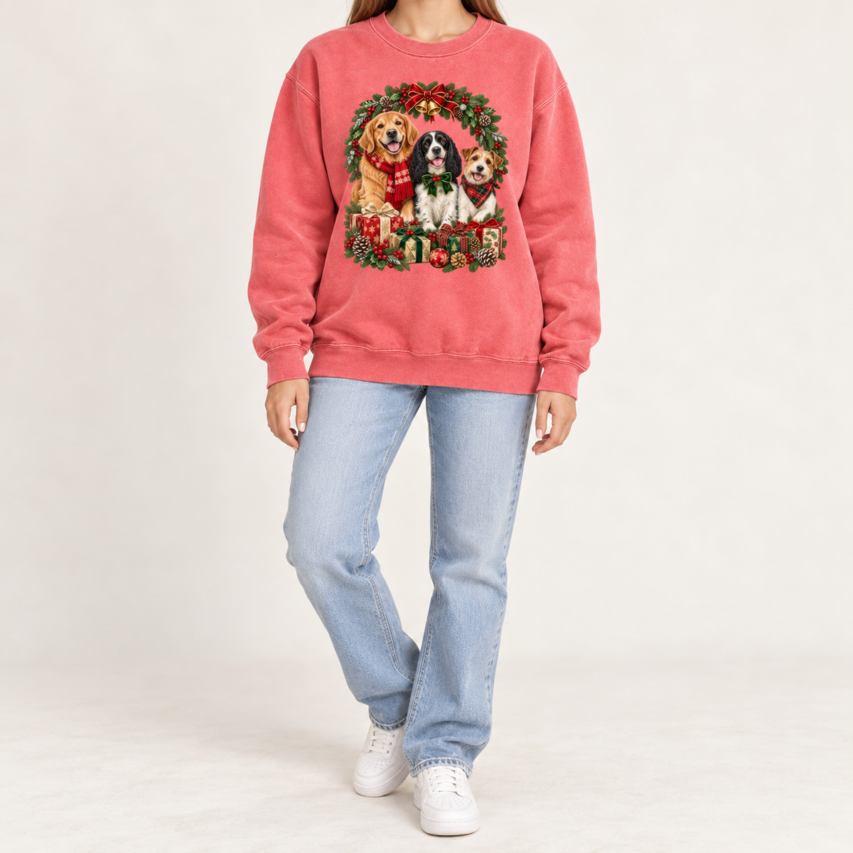 The three-dog Christmas wreath print shown on the Watermelon garment-dyed Comfort Colors 1566 crewneck sweatshirt