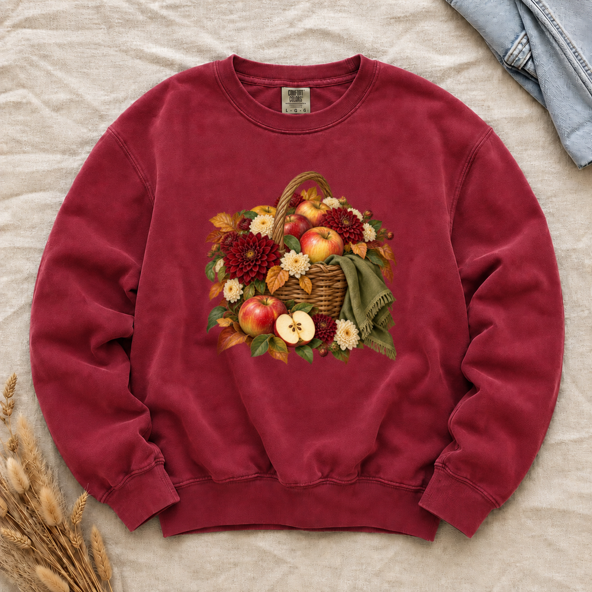 We Picked Too Many apple harvest sweatshirt in Crimson, a woven basket of red and golden apples