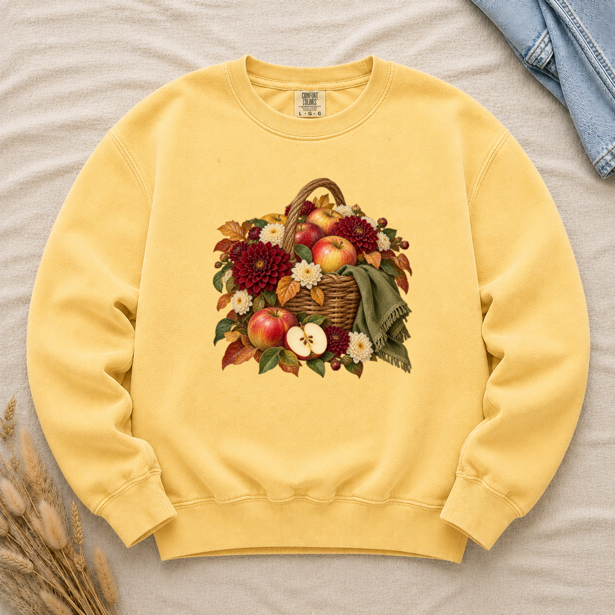 We Picked Too Many apple harvest sweatshirt in Butter, a golden apple harvest basket print