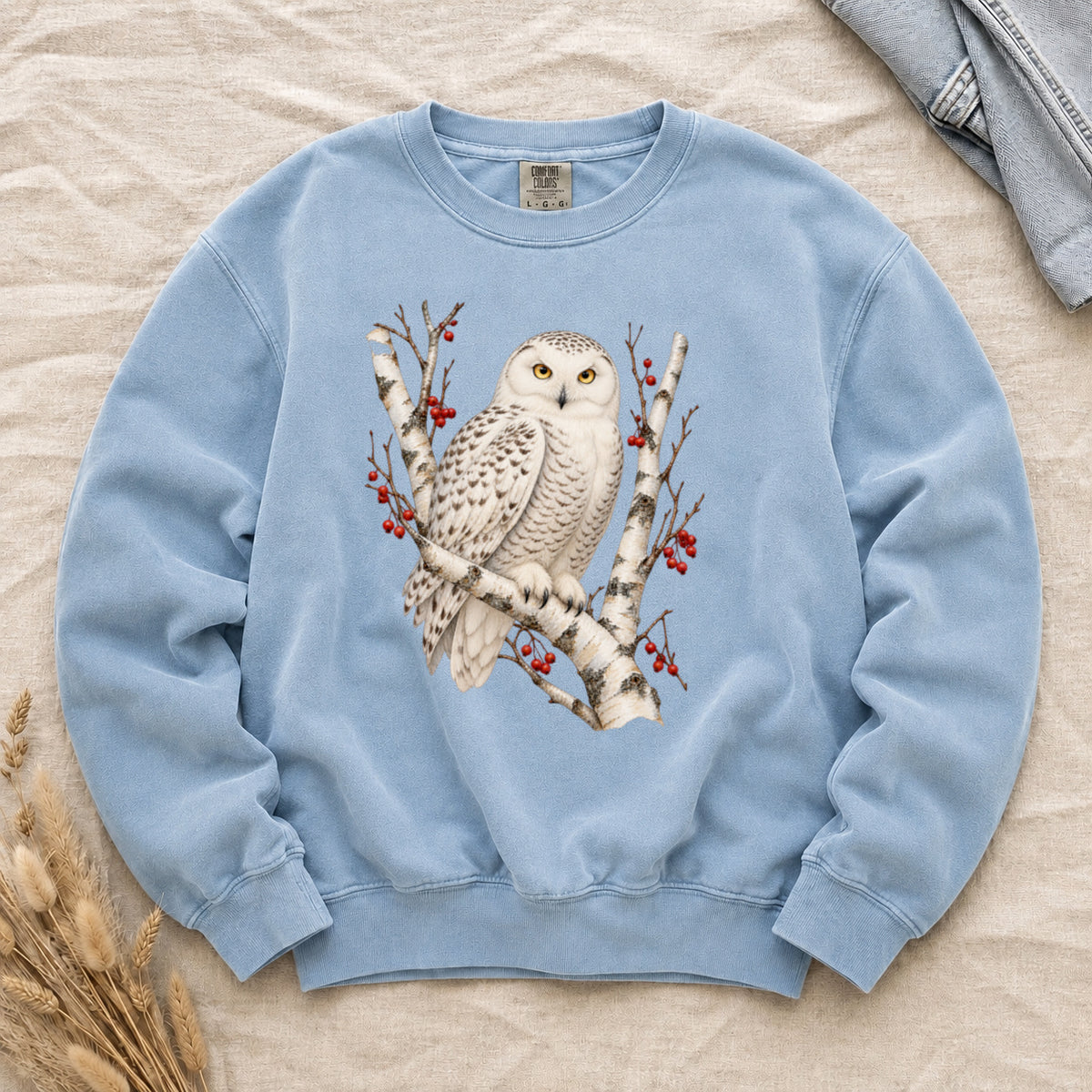When the Woods Grow Quiet sweatshirt in Chambray, a snowy owl among white birch branches and red winter berries