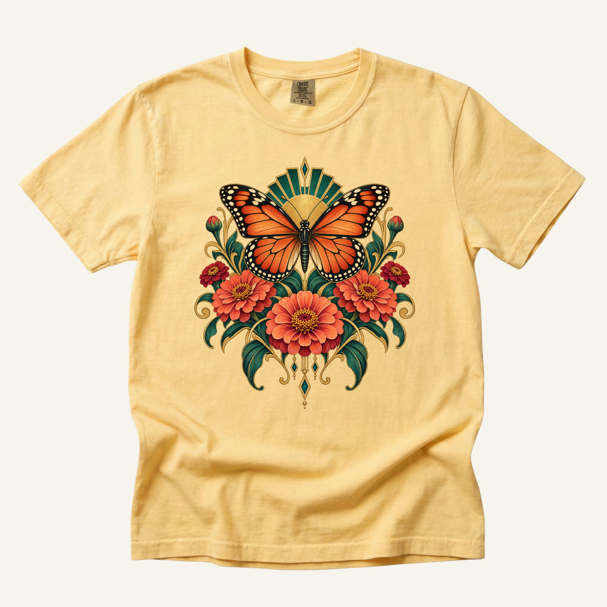 Where Summer Lands T-Shirt in Butter — an orange butterfly above symmetrical flowers with gold Art Deco detail