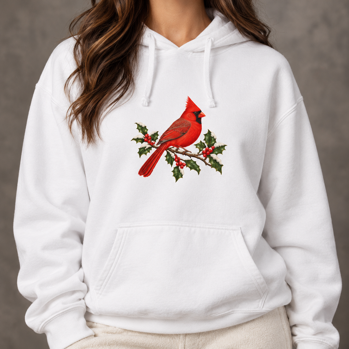 Winter Cardinal hoodie in White worn, front view with a red cardinal on a snowy holly branch