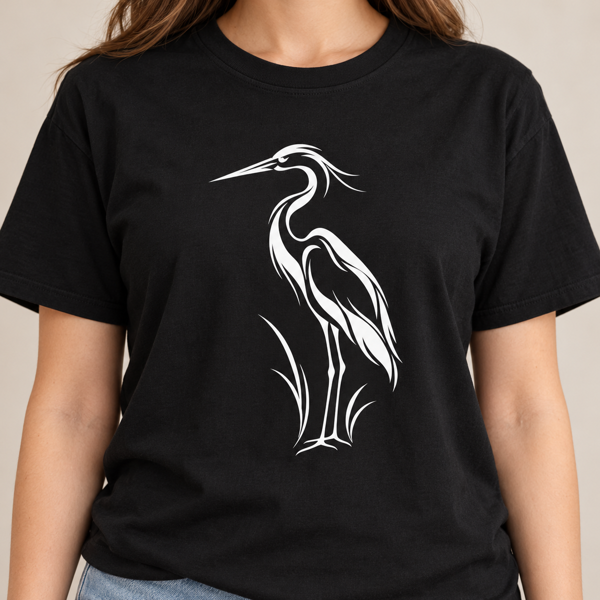 Close-up of the white line-art heron print on a Black garment-dyed Comfort Colors tee