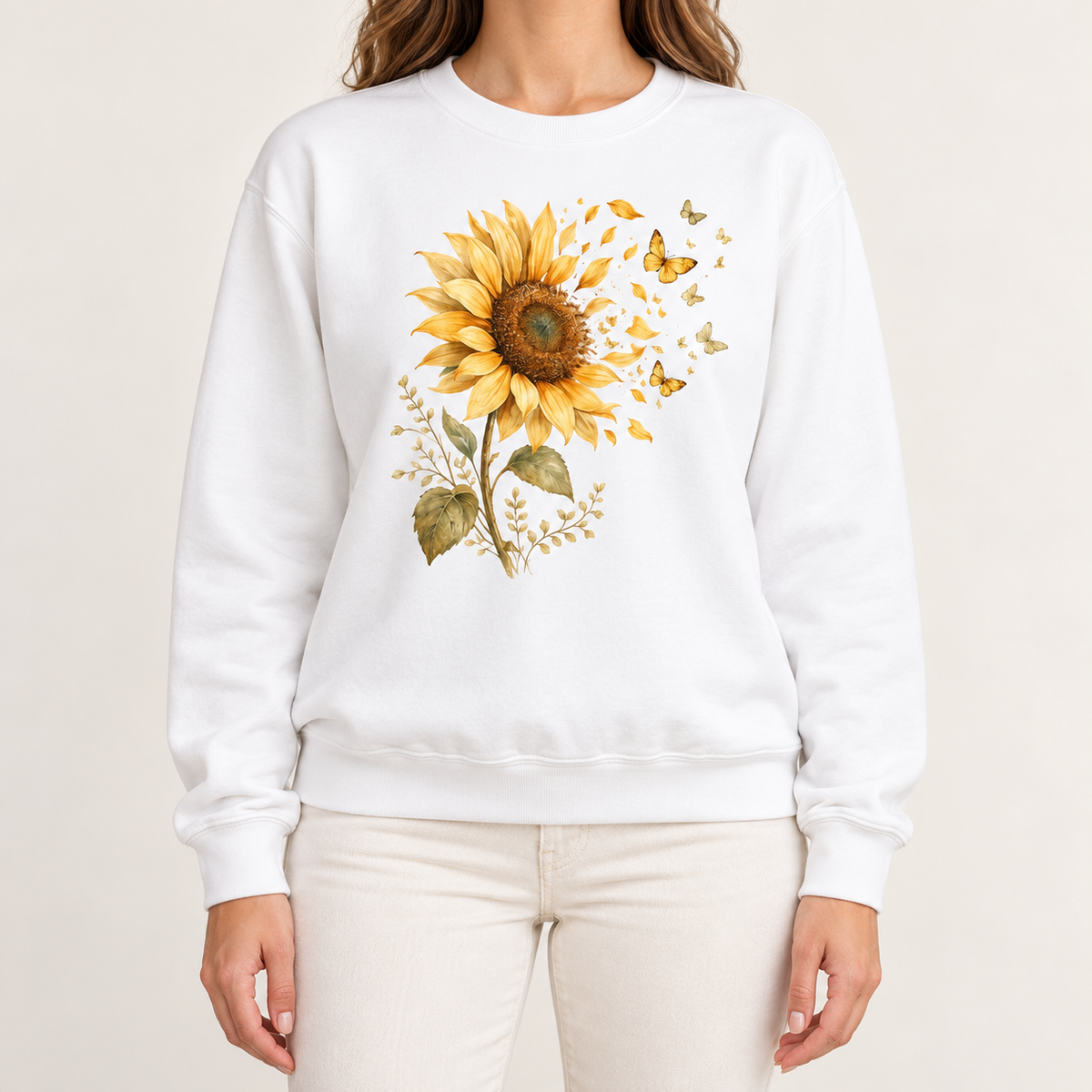 Sunflower butterfly sweatshirt in White – a golden watercolor sunflower letting go of its petals as small gold butterflies, printed large on the chest of a Comfort Colors crewneck
