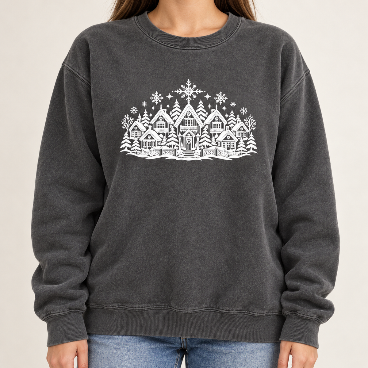 The winter village line art print shown large and centered on the chest of the Pepper garment-dyed crewneck sweatshirt, not a back print