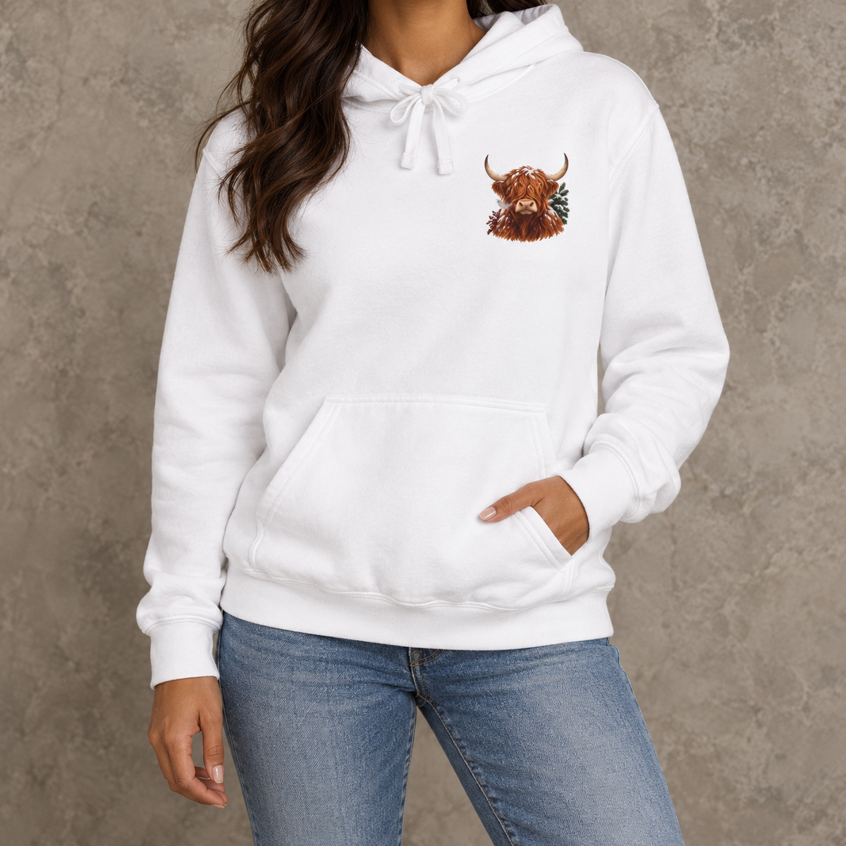 Winter Highland Cow hoodie in White worn, close view of the highland cow crest