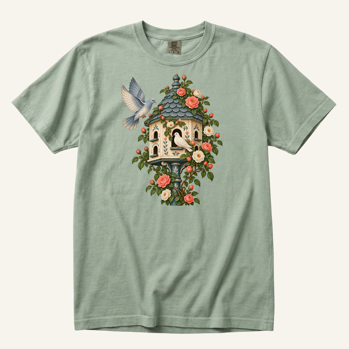 Whoever Gets There First T-Shirt in Bay — two doves at an ornamental dovecote wrapped in coral climbing roses, sizes S to 4XL