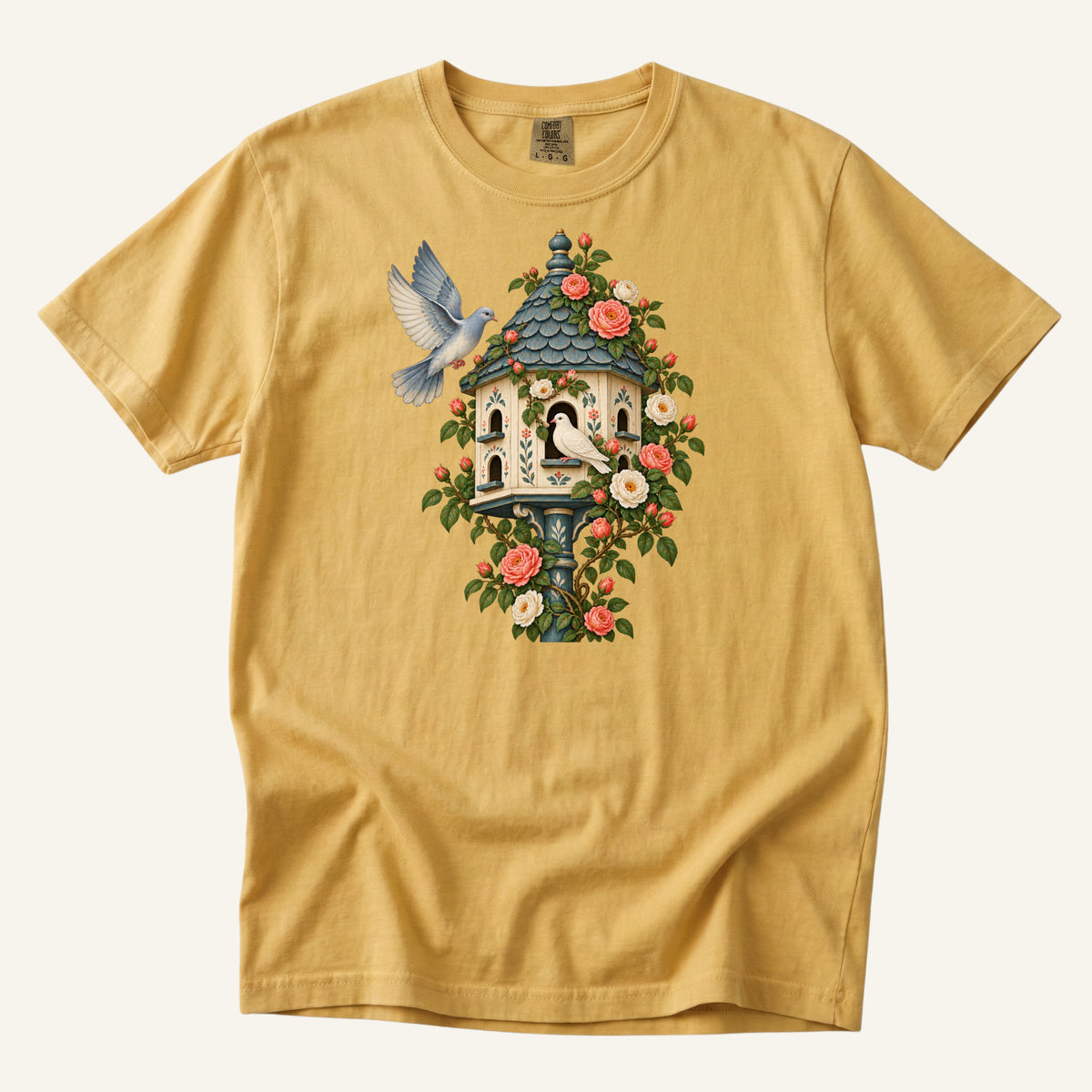 Whoever Gets There First T-Shirt in Mustard — a warm vintage gold contrasting the blue-grey roof and wings