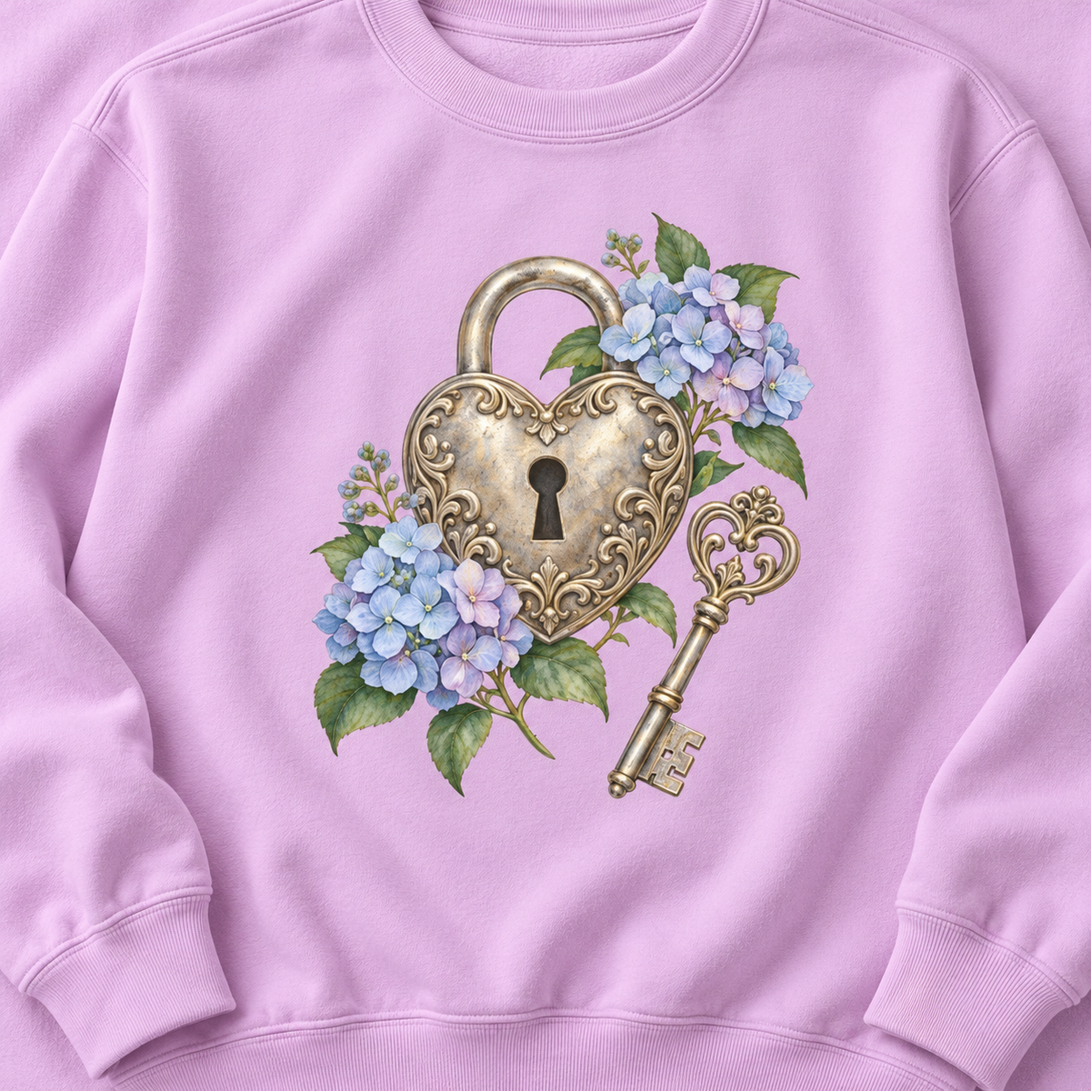 Detailed watercolor of a silver filigree heart padlock and skeleton key among blue and purple hydrangeas, printed large and centered on the front of an Orchid soft lilac 9.5 oz garment-dyed Comfort Colors 1566 sweatshirt, shown flat