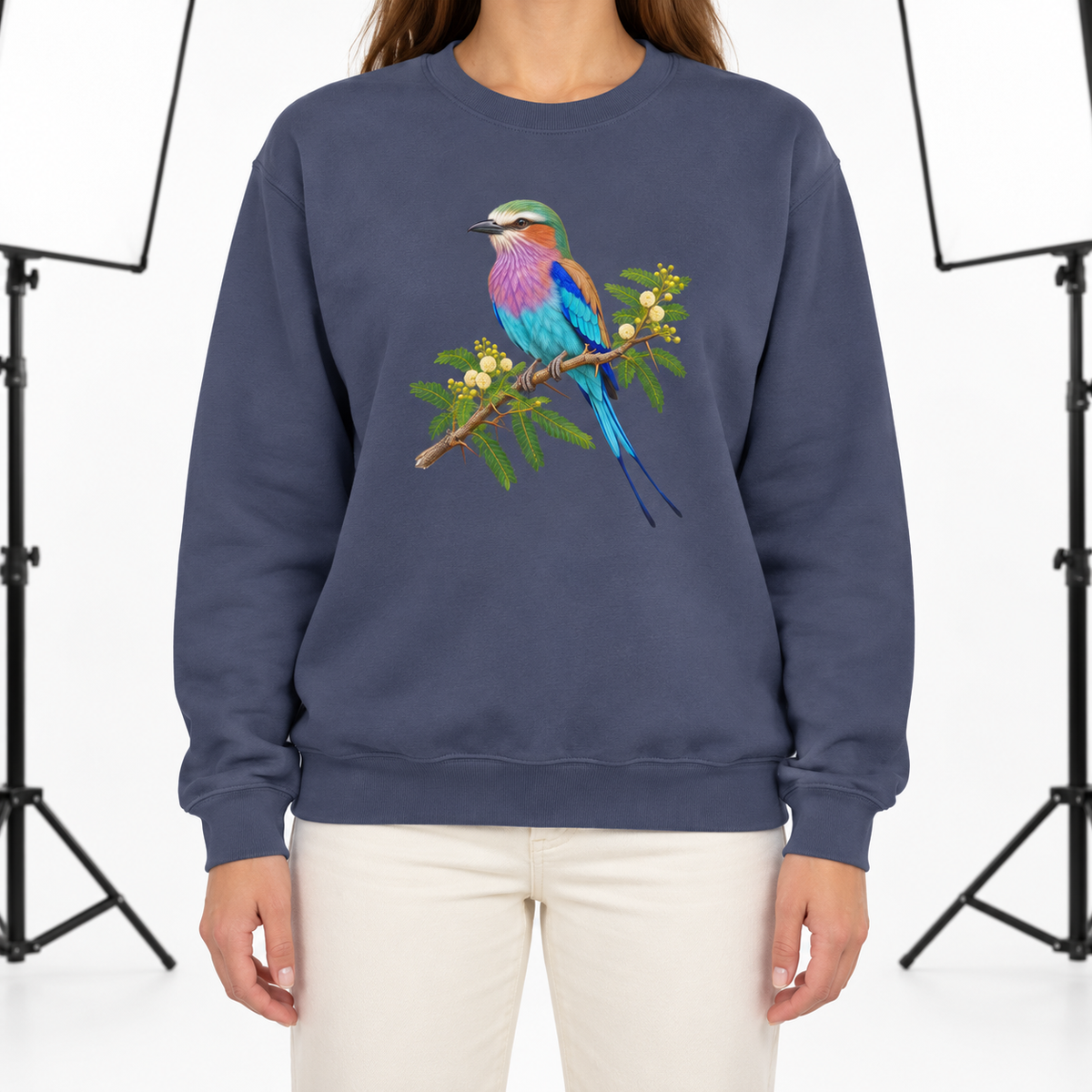 Woman wearing the Lilac-Breasted Roller on Acacia sweatshirt in Denim
