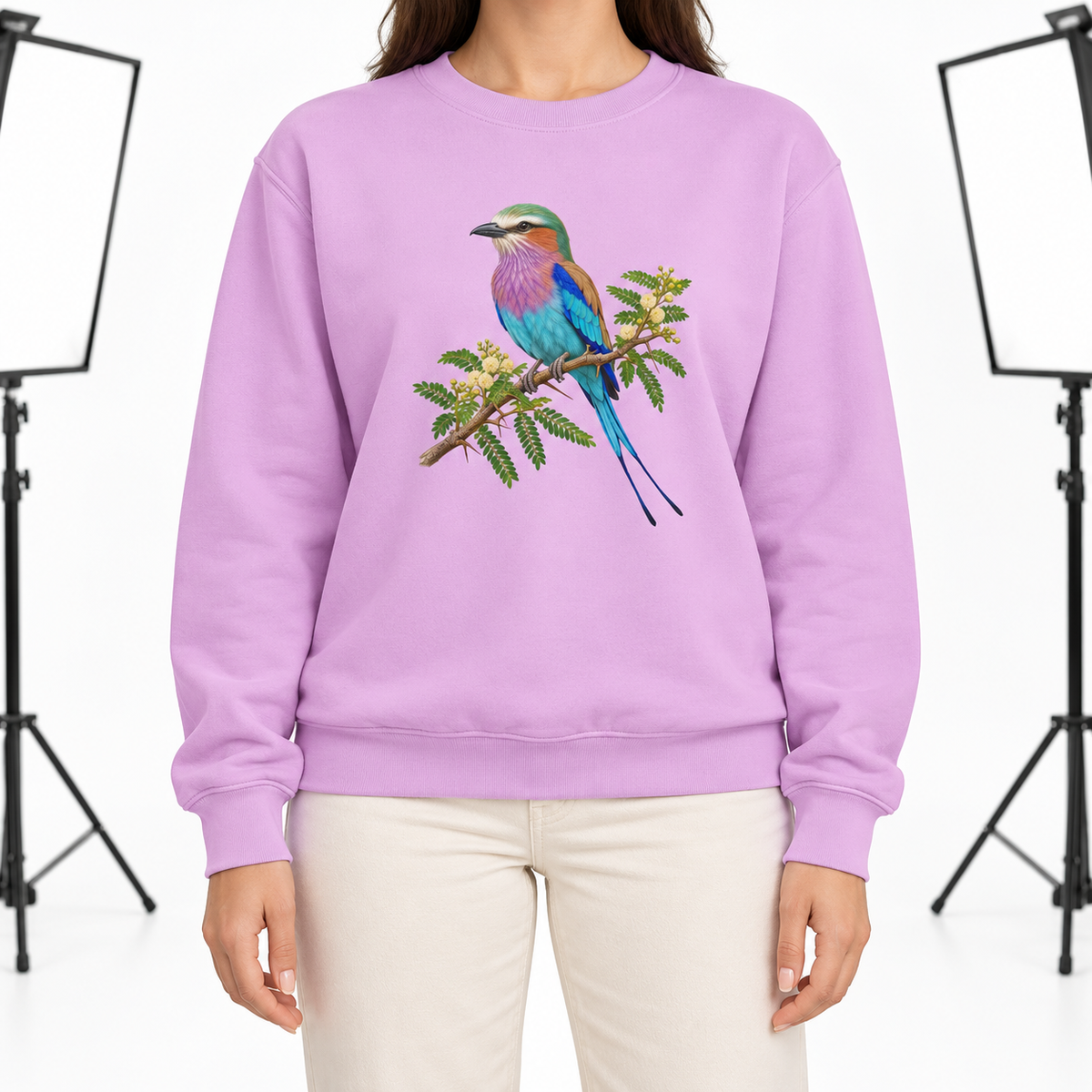 Woman wearing the Lilac-Breasted Roller on Acacia sweatshirt in Orchid