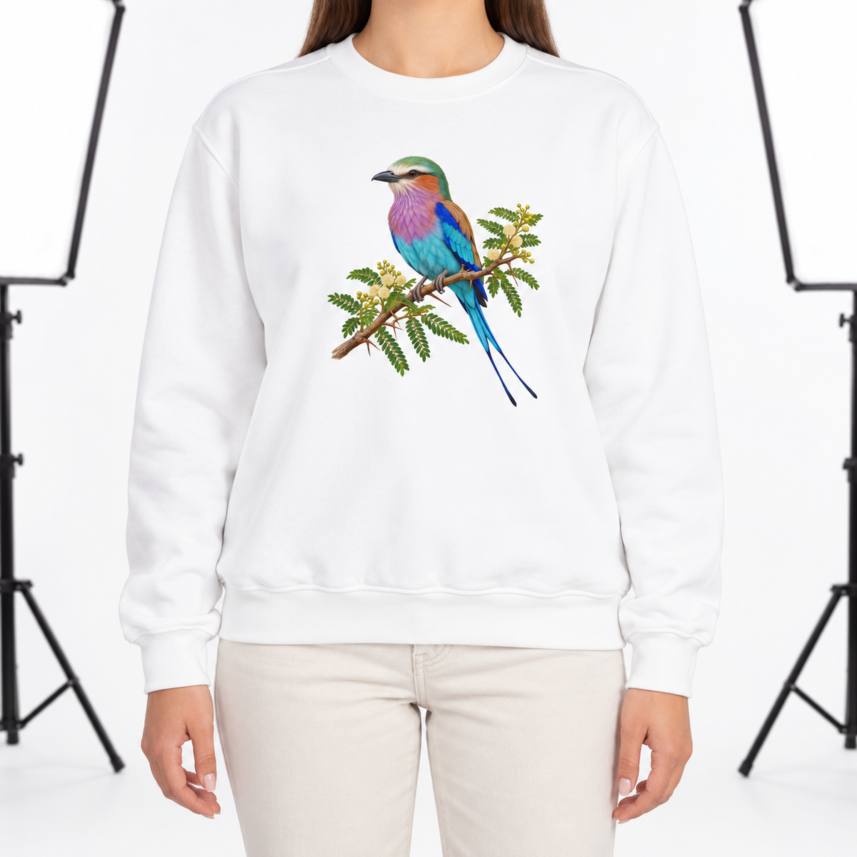 Woman wearing the Lilac-Breasted Roller on Acacia sweatshirt in White