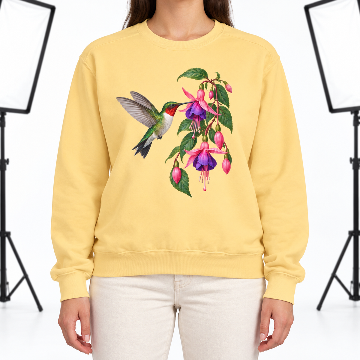 Woman wearing the Ruby-throated Hummingbird & Fuchsia sweatshirt in Butter