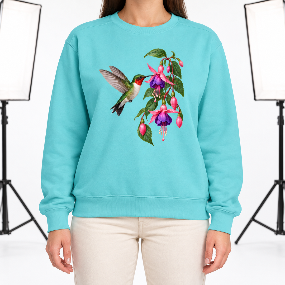 Woman wearing the Ruby-throated Hummingbird & Fuchsia sweatshirt in Chalky Mint