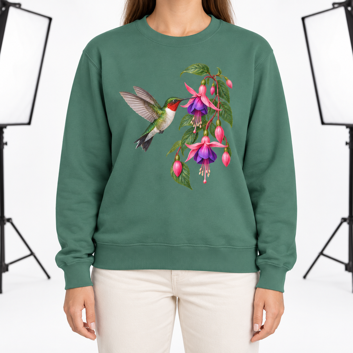Woman wearing the Ruby-throated Hummingbird & Fuchsia sweatshirt in Light Green